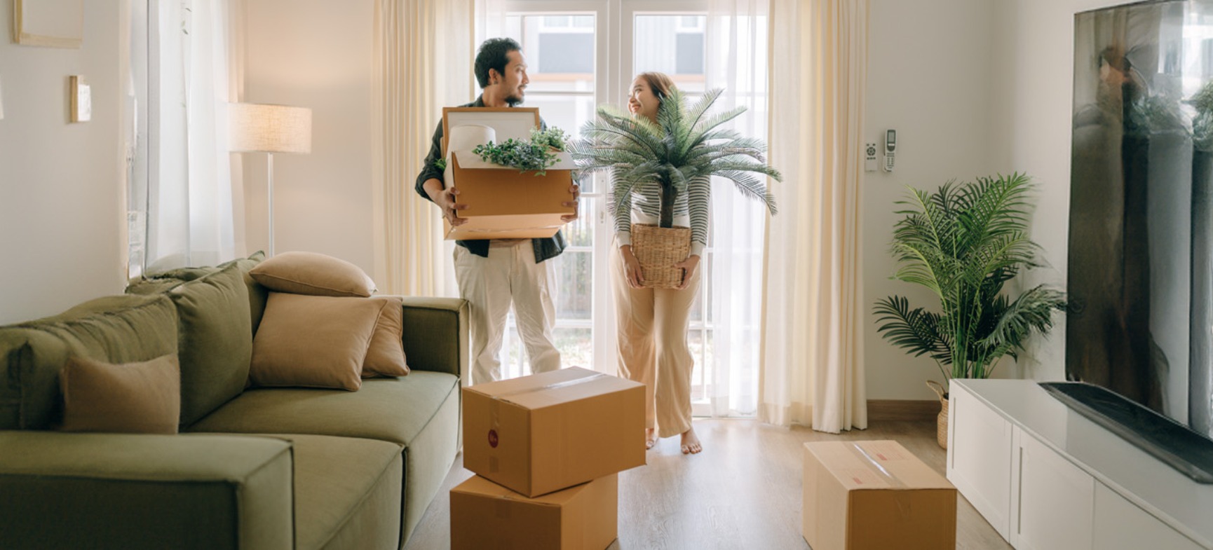 a couple setting up their new home